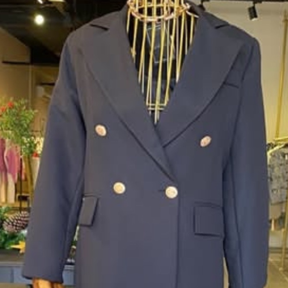 Black jacket with gold color buttons